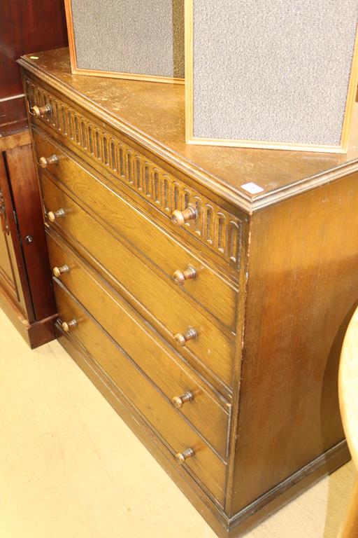 An oak chest of drawers and an oak bench