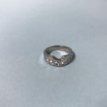A platinum ring, mounted with seven diamonds, size J, 7g