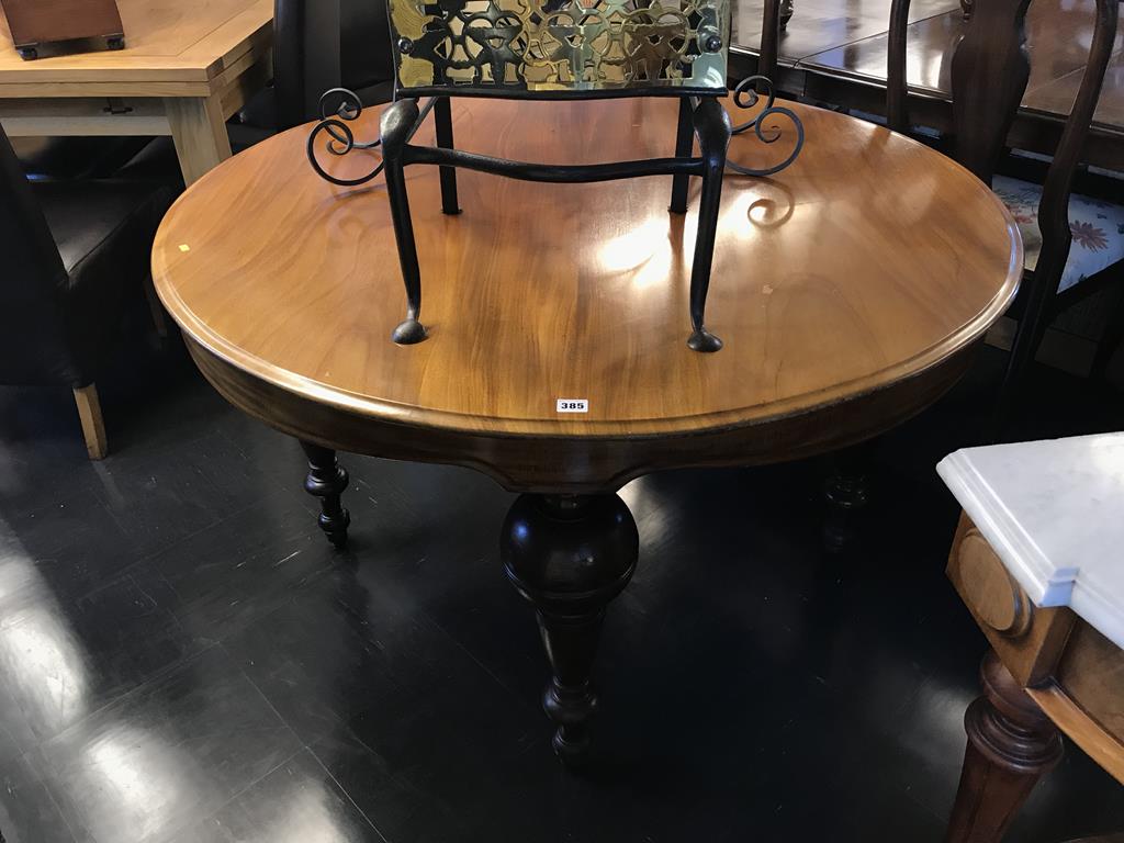 A Continental mahogany circular dining table