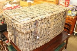 A wicker hamper, various tools and a vacuum