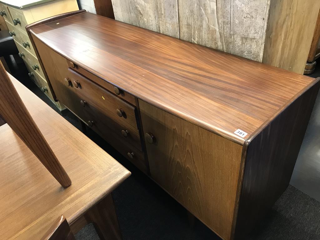 A teak Younger dining room suite, comprising drawer leaf table, six chairs and a sideboard