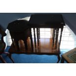 An octagonal inlaid brass table, a coffee table and a nest of tables