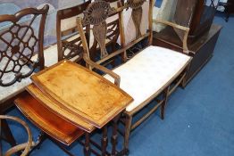 An Edwardian mahogany two seater settee and a nest of tables