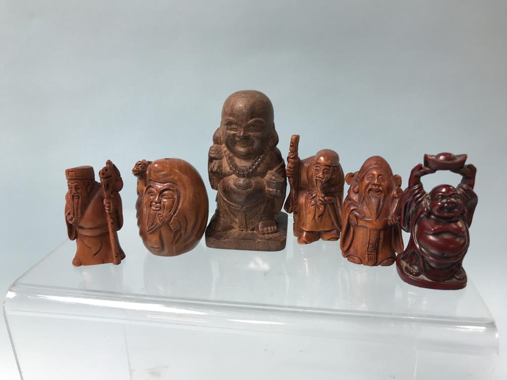 A collection of six carved and resin netsukes