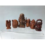 A collection of six carved and resin netsukes