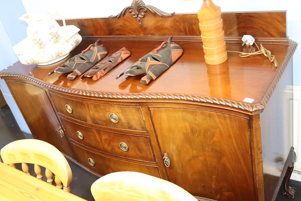 A mahogany serpentine front sideboard