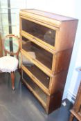 A Wilton oak four tier stacking bookcase