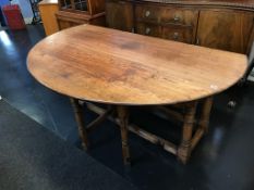 A large oak gateleg dining table
