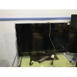 A Samsung 31" TV, with remote