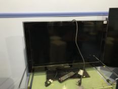 A Samsung 31" TV, with remote