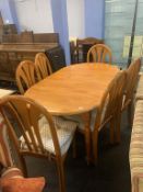 A kitchen table and six chairs