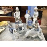 A collection of Lladro and Nao figures (11)