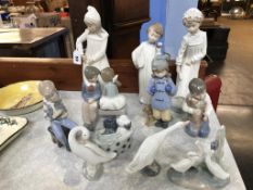 A collection of Lladro and Nao figures (11)