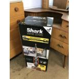 A boxed, as new Shark vacuum