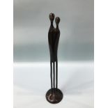 A modern abstract bronze sculpture of two people, 43cm height