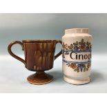 An Italian bottle and a two handled treacle glaze loving cup