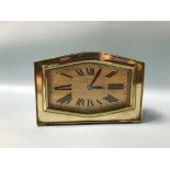 A brass cased clock