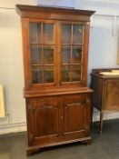 An oak four door cabinet