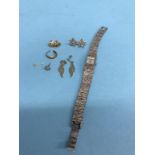 A silver bark effect wristwatch and various earrings