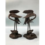 A pair of Oriental bronze storks, 29cm height