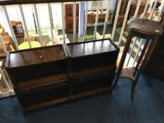 A pair of bookcases and a pedestal