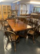 A heavy oak drawer leaf dining table, with eight chairs