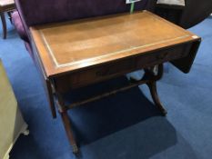 A reproduction mahogany sofa table with inset leather top
