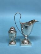 A silver cream jug and a pepper pot, 4oz