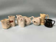 Eight various whisky water jugs