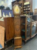 An oak cased Grandmother clock, with eight day movement and strike action