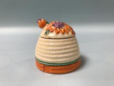 A Clarice Cliff Bizarre 'Marguerite' pattern preserve pot, 7cm height