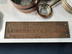 A cast iron advertising wall plaque, 'The Superlyte', Laingbury and Sons Ltd, 14 x 53cm