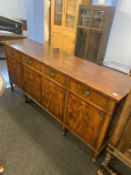 A reproduction mahogany sideboard