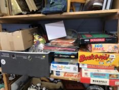 A shelf of assorted vintage board games etc.