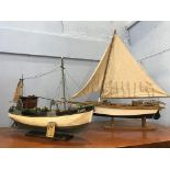 Two model sailing vessels