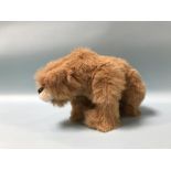 An Issy Bears realistic Bear, with fawn long pile plush, black glass eyes, moulded Fimo clay nose,