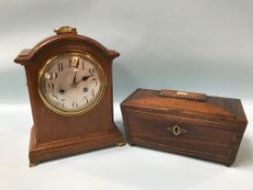 An Edwardian oak mantel clock and a rosewood tea caddy