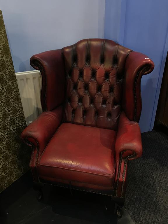 An oxblood leather Chesterfield high back armchair