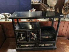 An Oriental lacquered side cabinet, 70cm wide