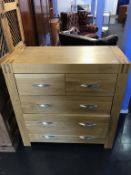 A modern light oak chest of drawers, 95cm wide