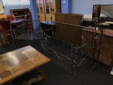 A metalwork frame, day bed, armchair and candlestand