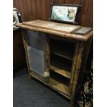 A Victorian bamboo two door cabinet