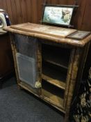 A Victorian bamboo two door cabinet