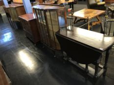 A chest of drawers, china cabinet and a gateleg table