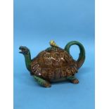 A rare Minton majolica tortoise teapot, the tortoise's head protruding from its brown shell to