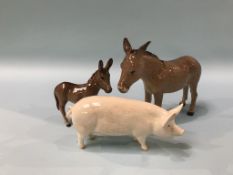 A Beswick Pig and two Donkeys