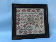 A sampler by Hannah Holiday, aged 11, dated 1834, 41 x 45cm