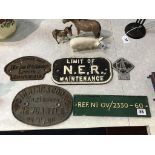 Four original cast iron plaques, and a car badge