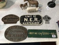 Four original cast iron plaques, and a car badge