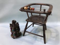 A child's chair and a bobbin stand